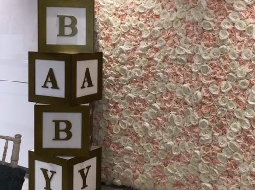 Baby shower decoration in london, flower wall, baby boxes and baby letter table 