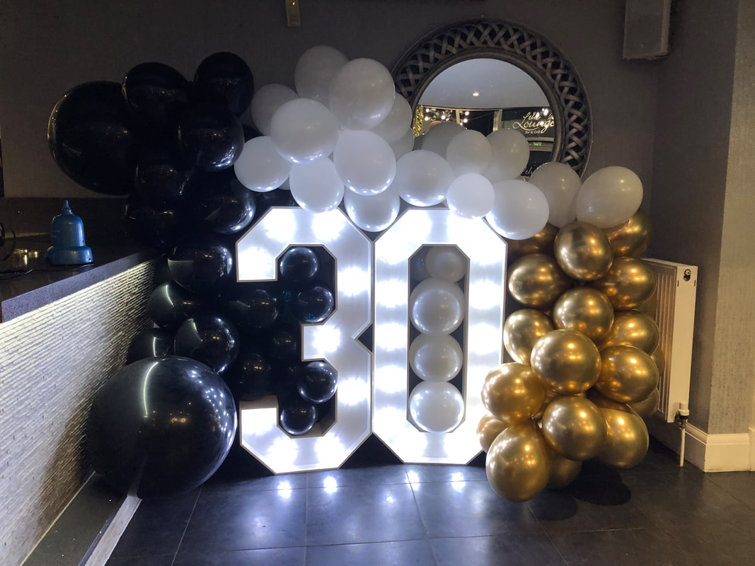 Laurens surpise 30th Birthday for her boyfriend Aaron. Light up numbers 30 with organic balloon arch.