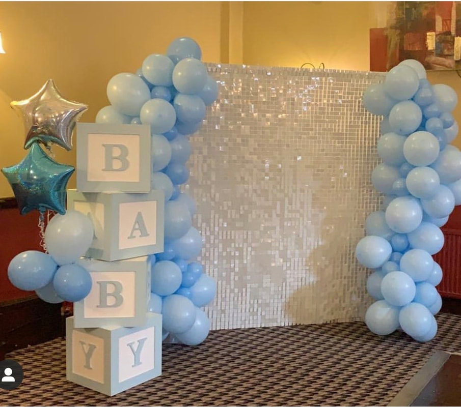White sequin wall with baby blue organic columns